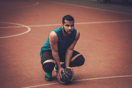 African-american streetball player practicing outdoorsの写真素材