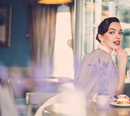 Gossip girl in a cafeの写真素材