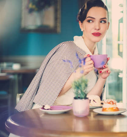 Gossip girl in a cafeの写真素材