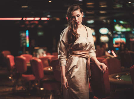 Beautiful woman in a luxury casino interiorの写真素材