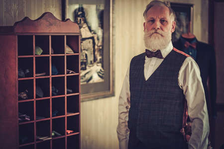 Senior man and custom made bow ties and neckties.の写真素材