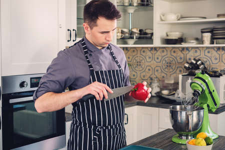 Chef cook working on a modern kitchen at home