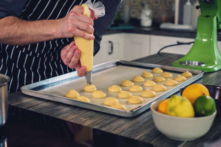 Chef cook working on a modern kitchen at homeの写真素材