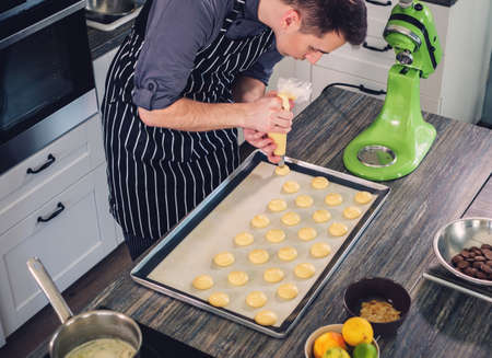 Chef cook working on a modern kitchen at home