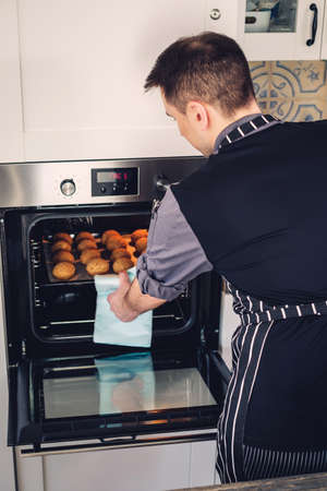 Chef cook working on a modern kitchen at home