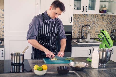 Chef cook working on a modern kitchen at home