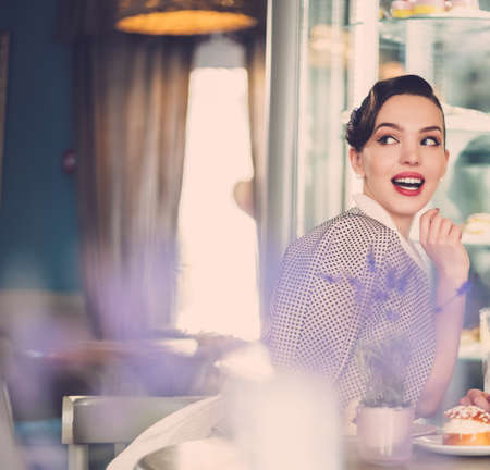 Gossip girl in a cafeの写真素材