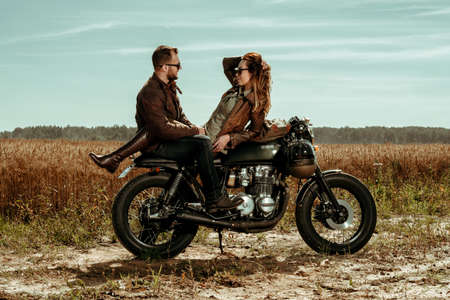 Couple and cafe racer motorcycleの写真素材