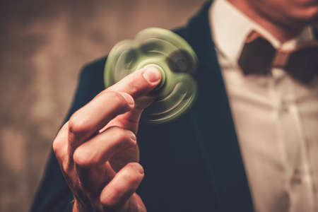 Young illusionist performing tricks on a stage.の写真素材