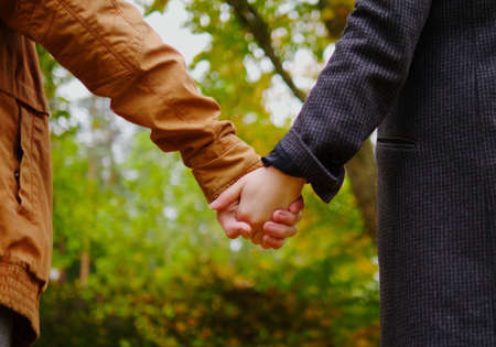 Lovely couple in autumn park.の写真素材