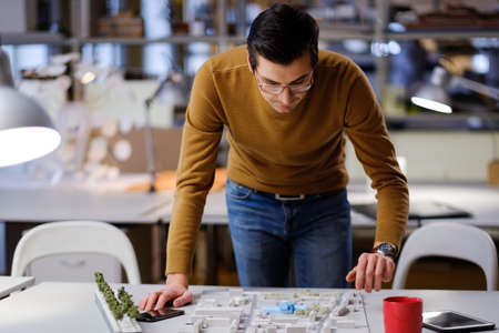 Man working in design and engineering architecture office.