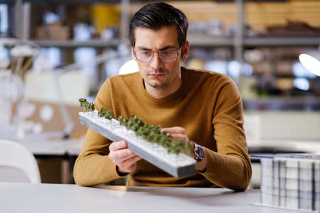 Man working in design and engineering architecture office