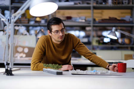 Man working in design and engineering architecture office.の写真素材