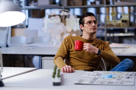 Man working in design and engineering architecture office.の写真素材