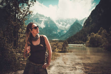 Woman enjoying amazing view of Lago di Braies.の写真素材