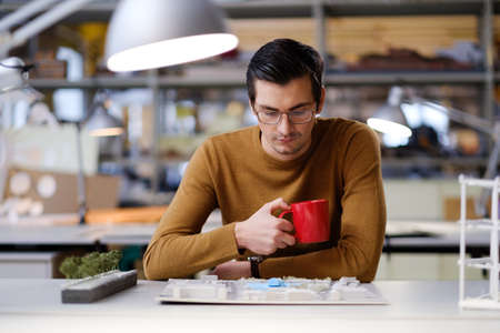 Man working in design and engineering architecture office.