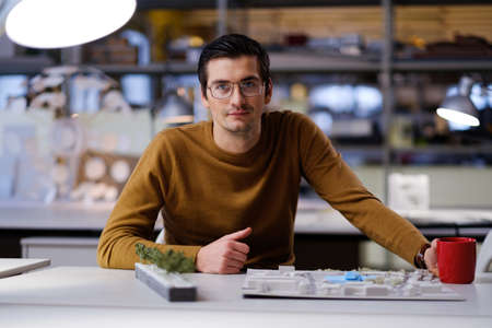 Man working in design and engineering architecture office.の写真素材