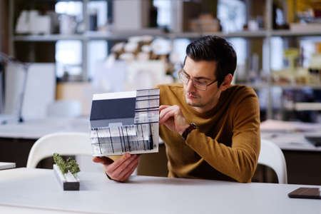 Man working in design and engineering architecture office.の写真素材