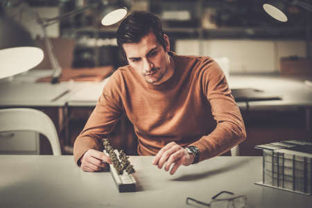 Man working in design and engineering architecture office.