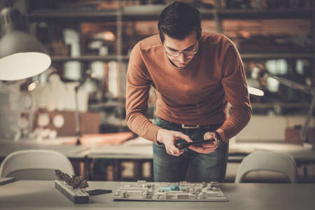 Man working in design and engineering architecture office.の写真素材