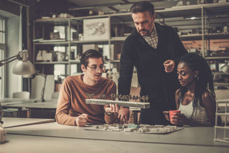 Multiracial team working in design and engineering architecture office.の写真素材