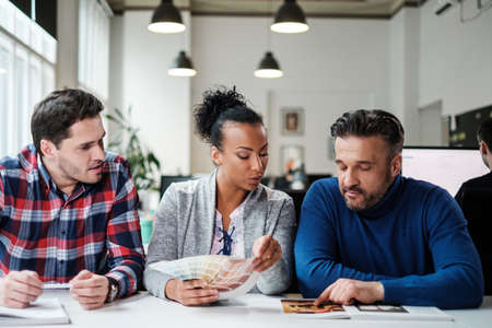 Multi-ethnic colleagues in a coworking office.の写真素材