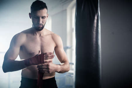 Man boxer training hard for a fight.の写真素材