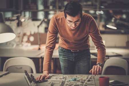 Man working in design and engineering architecture office.の写真素材