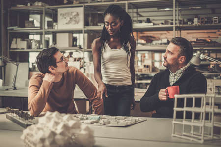 Multiracial team working in design and engineering architecture office.の写真素材