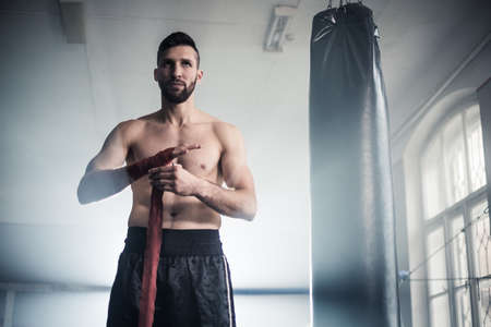 Man boxer training hard for a fight.の写真素材