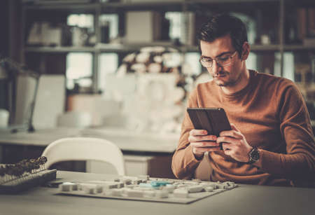 Man working in design and engineering architecture office.の写真素材