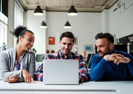 Multi-ethnic colleagues in a coworking office.の写真素材