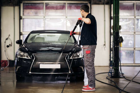 Man working on a car wash.の写真素材