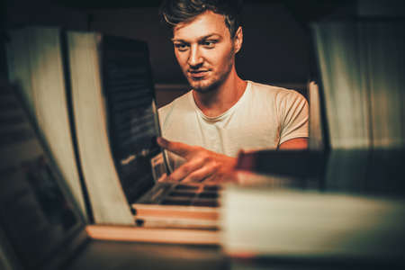 Young man in a college library.