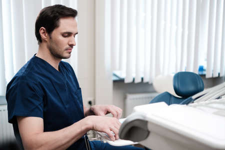 Man dentist working in private practice.