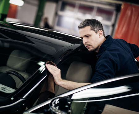 Man polishing car on a car wash.