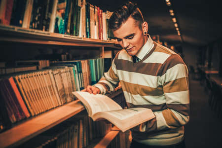 Young man in a college library.