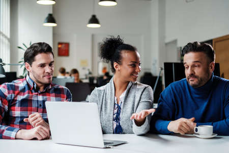 Multi-ethnic colleagues in a coworking office.