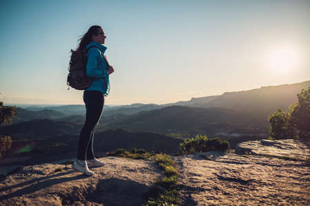 Woman hiker on a top of a mountainの写真素材
