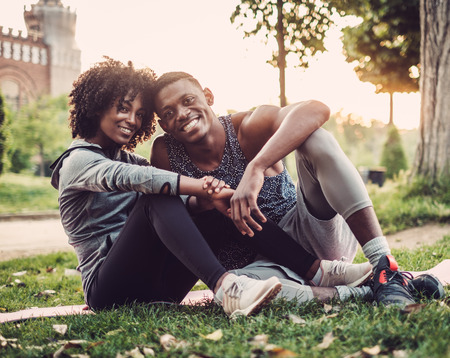 Black couple doing exercise outdoorsの写真素材
