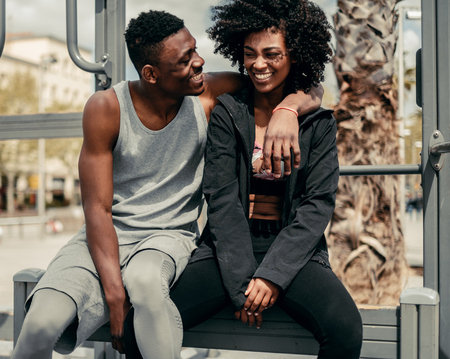 Young happy black couple outdoors