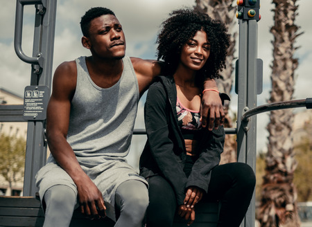 Young happy black couple outdoors