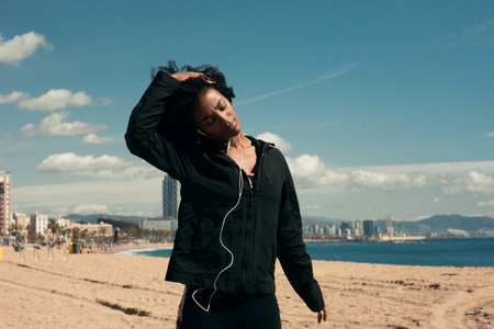 Young happy black woman workout outdoorsの写真素材