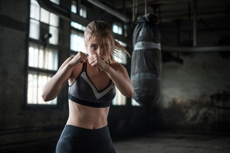 Female Boxer preparing for training in Boxing Clubの写真素材