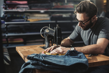 Fashion designer working in his studioの写真素材