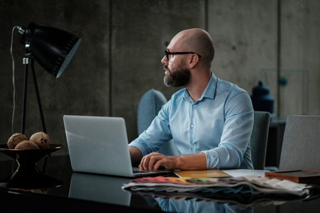 Middle-aged designer working in officeの写真素材