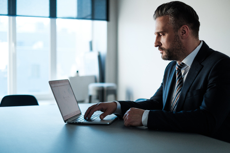 Middle-aged businessman on a phone.の写真素材