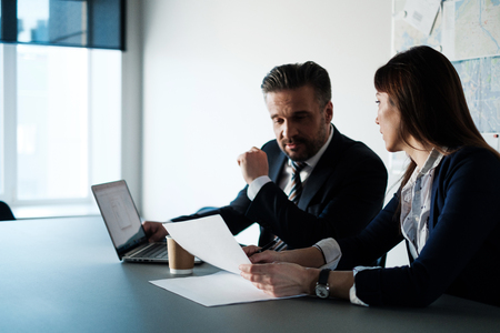 Business people talking in modern officeの写真素材