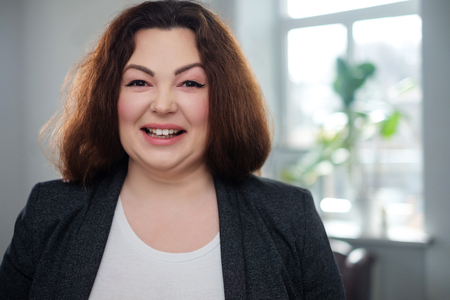 Portrait of a cheerful plus size modelの写真素材