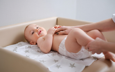 Baby boy getting a massage from masseuseの写真素材